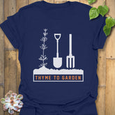 Navy t-shirt featuring the design "Thyme To Garden" with garden tool illustrations, a comfortable gardening shirt for plant enthusiasts.