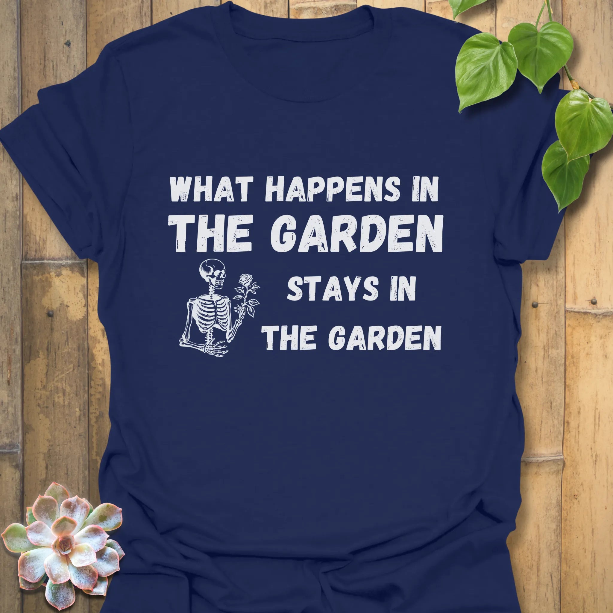 Navy t-shirt featuring the design What Happens in the Garden Stays in the Garden, stylish garden graphic shirt