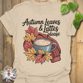 Sand t-shirt featuring the design Autumn Leaves & Lattes printed in cosy fall shirt for coffee lovers.