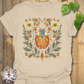 Sand t-shirt featuring the design Blossom Beetle printed in nature-inspired floral beetle shirt.