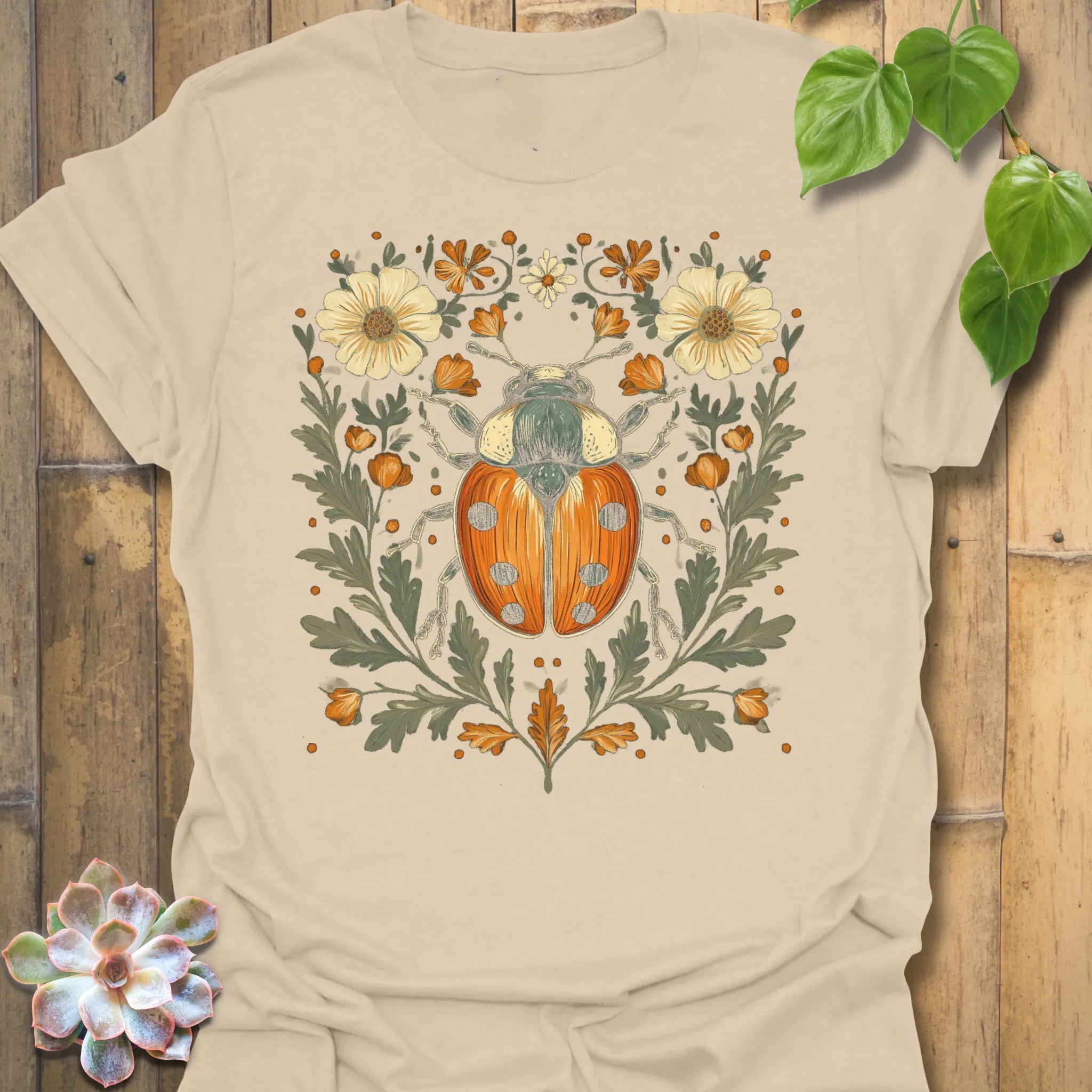 Sand t-shirt featuring the design Blossom Beetle printed in nature-inspired floral beetle shirt.