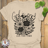 Sand t-shirt featuring the design God Is Good printed in black letters, religious faith shirt.