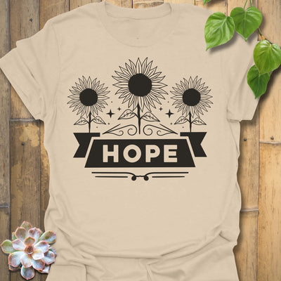 Sand t-shirt featuring the design Hope printed in sunflower and bold letters, positive vibe t-shirt.