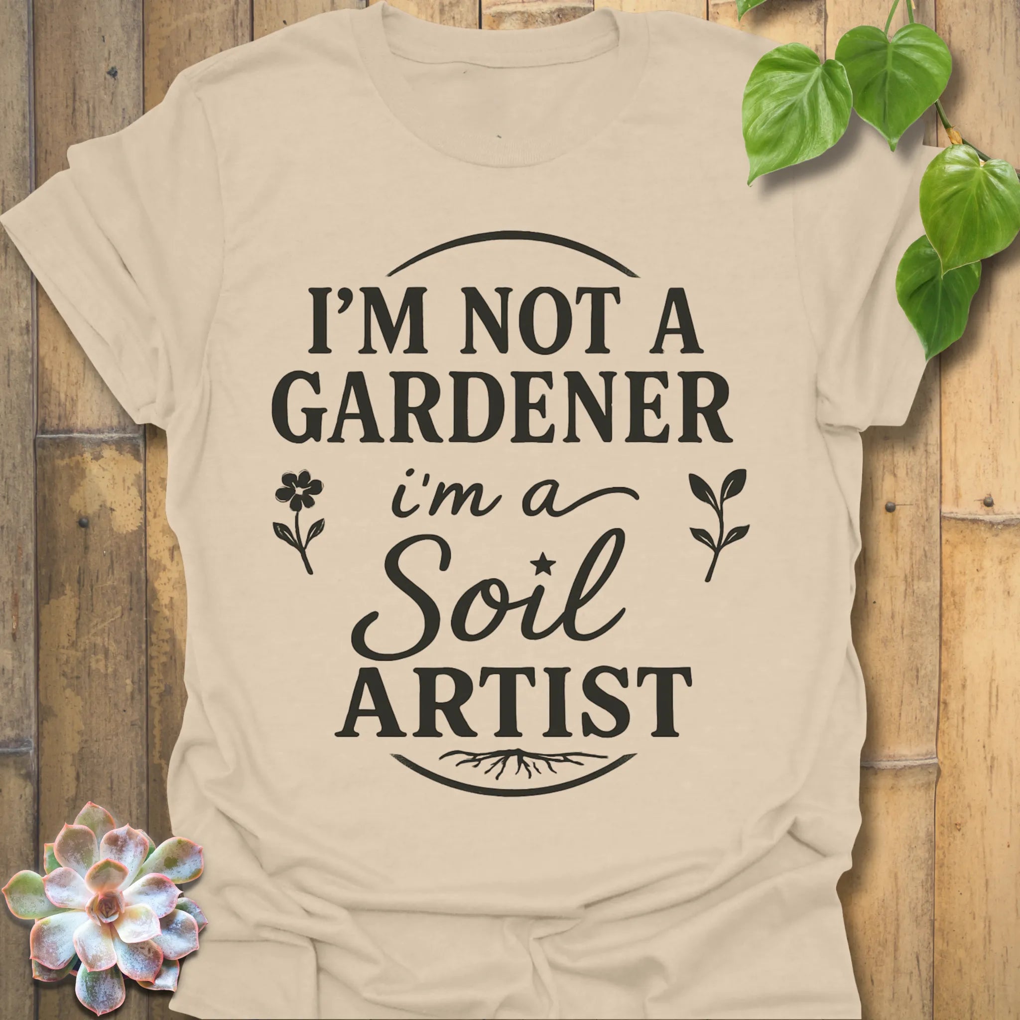 Sand t-shirt featuring the design Soil Artist printed in bold letters, funny garden shirt.