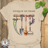 Sand t-shirt featuring the design Tools Of The Trade printed in bold letters, garden tools shirt.
