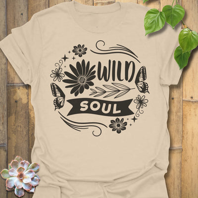 Sand t-shirt featuring the design Wild Soul printed in bold black letters, floral graphic tee.