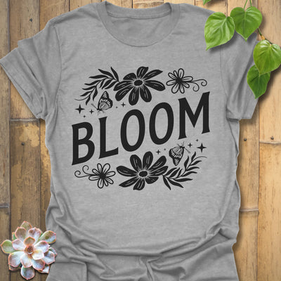 Sport Grey t-shirt featuring the design Bloom printed in bold black letters, floral graphic tee for plant lovers.