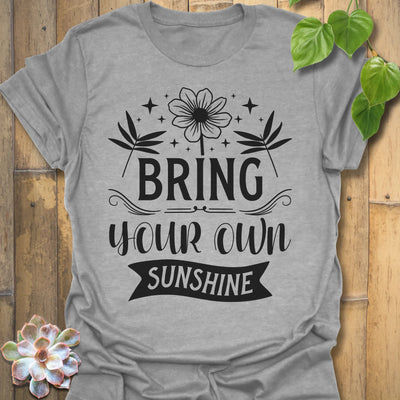 Sport Grey t-shirt featuring the design Bring Your Own Sunshine printed in bold black letters, positive vibes shirt.