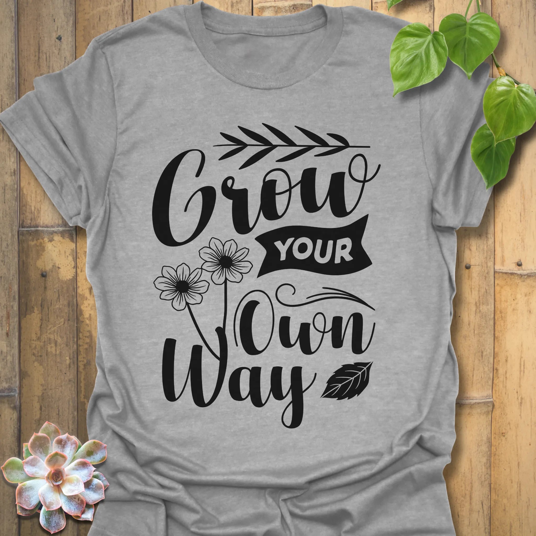 Sport Grey t-shirt featuring the design Grow Your Own Way printed in bold black letters, positive garden shirt