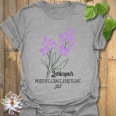 Sport Grey t-shirt featuring the design July Larkspur with a bold larkspur flower artwork, a versatile floral graphic t-shirt for everyday wear and botanical clothing lovers.