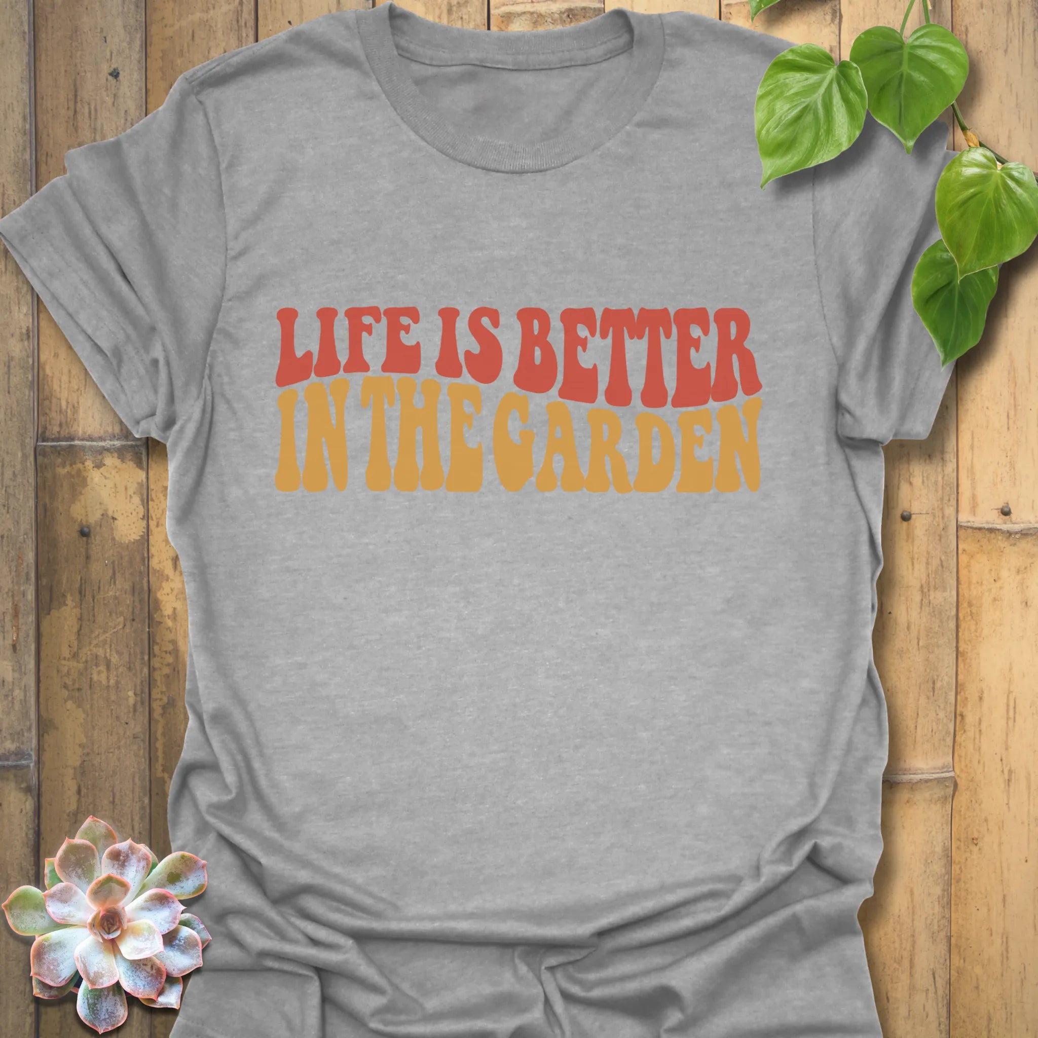 Sport Grey t-shirt featuring the design Life is better in the garden printed in green floral lettering, comfortable unisex gardening graphic tee