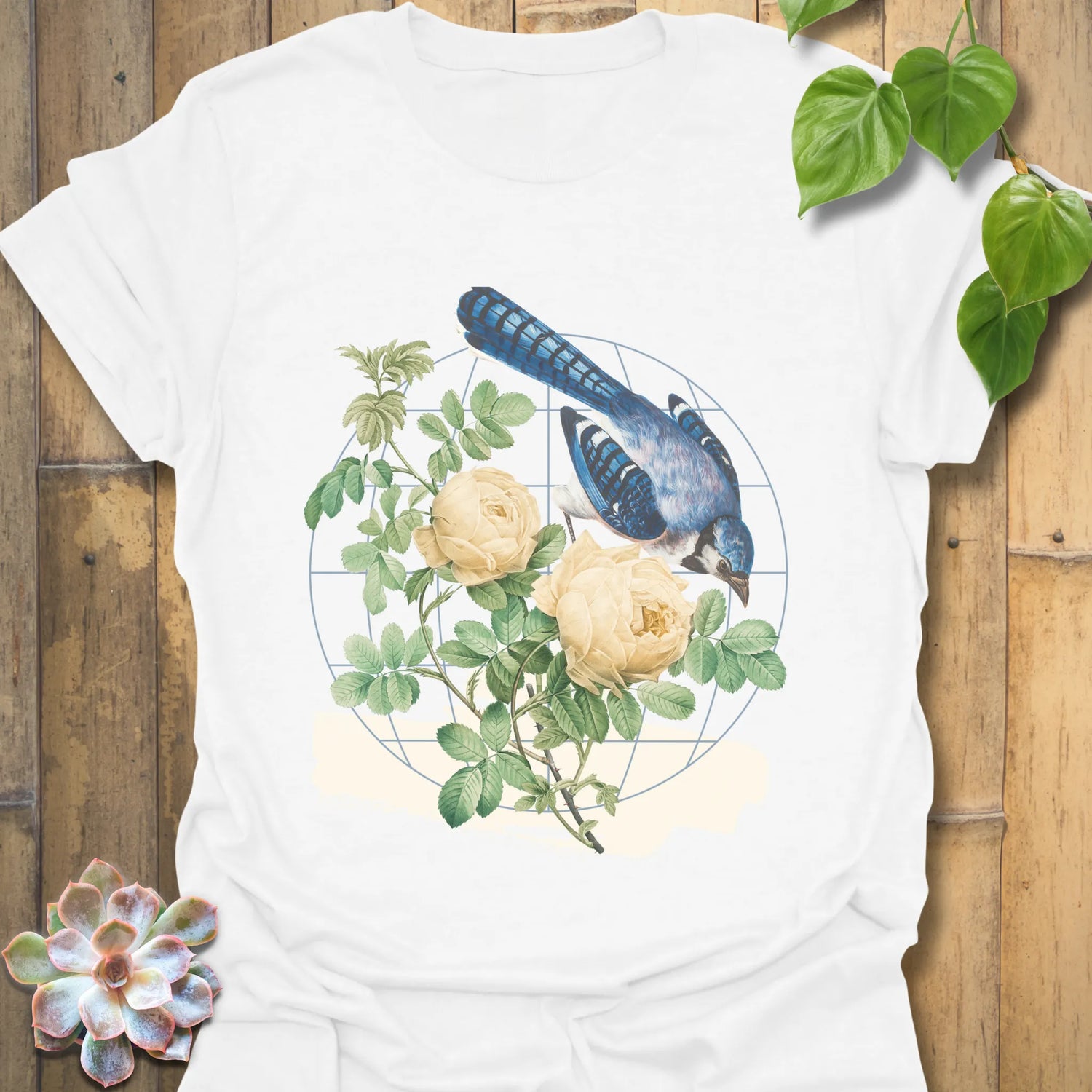 White t-shirt featuring the Botanical Flight design with a bird and flower print