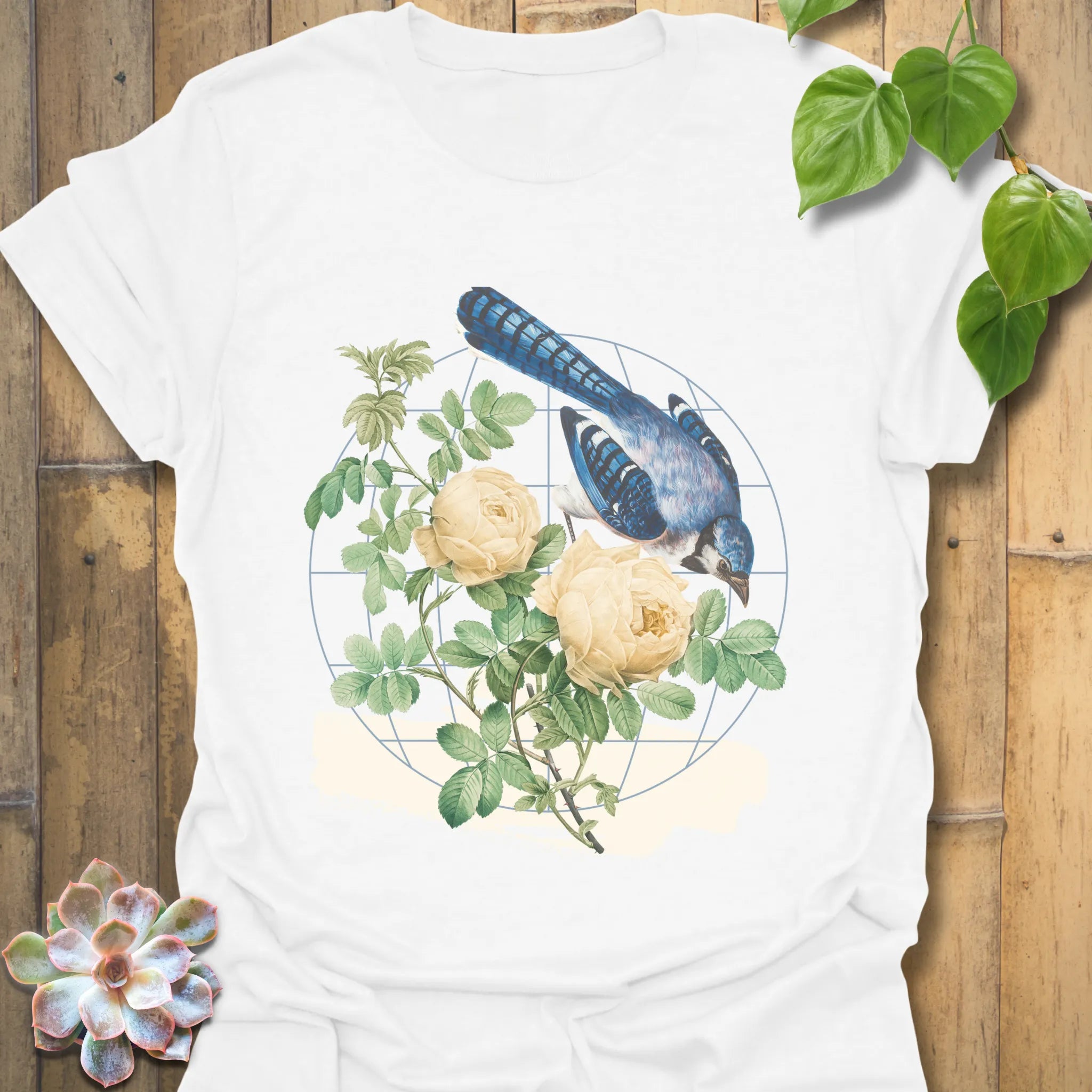 White t-shirt featuring the Botanical Flight design with a bird and flower print