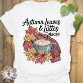 White t-shirt featuring the design Autumn Leaves & Lattes printed in cosy fall shirt for coffee lovers.