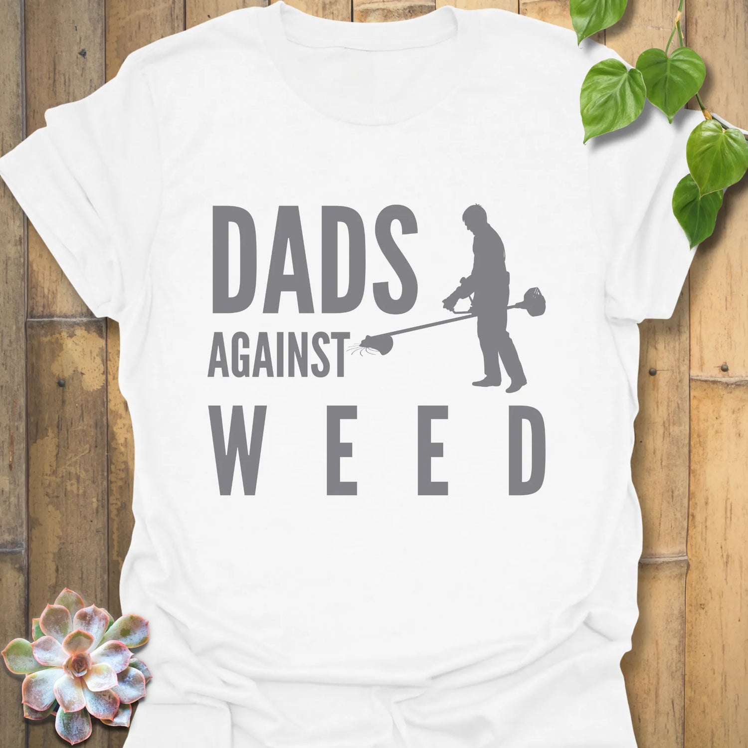 White t-shirt featuring the design Dad Against Weeds, funny gardening shirt.