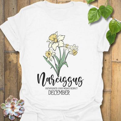 White t-shirt featuring the design December Narcissus printed with a delicate narcissus flower, perfect as a botanical flower graphic tee