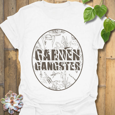 White t-shirt featuring the design Garden Gangster with printed garden tools, perfect gardening graphic tee for plant lovers.