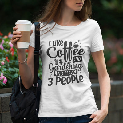 White t-shirt featuring the design &quot;I like coffee and gardening and maybe 3 people&quot; casual graphic tee for coffee lovers.