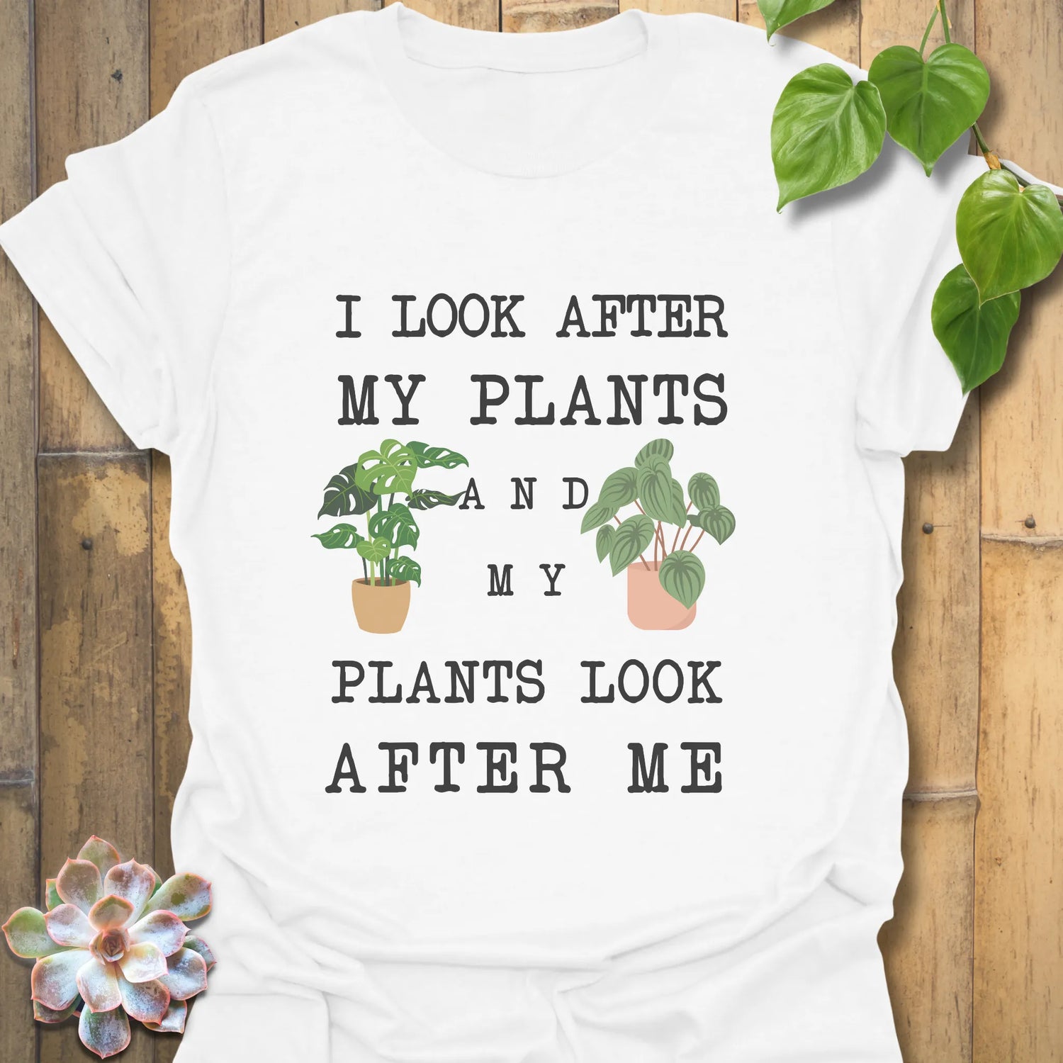 White t-shirt featuring the design “I look after My Plants and my plants look after me” plant lover shirt.