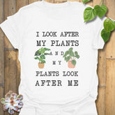 White t-shirt featuring the design “I look after My Plants and my plants look after me” plant lover shirt.