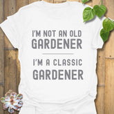 White t-shirt featuring the design “I’m not an older gardener, I’m a classic gardener” gardening humour shirt.