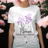 White t-shirt featuring the design July Larkspur with a delicate larkspur flower print, perfect for floral graphic tee lovers and botanical fashion enthusiasts.