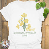 White t-shirt featuring the design March Daffodil with a print of flower Rose, perfect for floral graphic tee lovers.