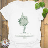 White t-shirt featuring the design May Lily of the Valley with Rose flower print, perfect for casual floral graphic tee lovers.