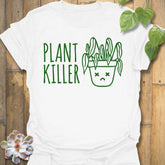 White t-shirt featuring the design Plant Killer printed in bold green letters, funny plant lover shirt.