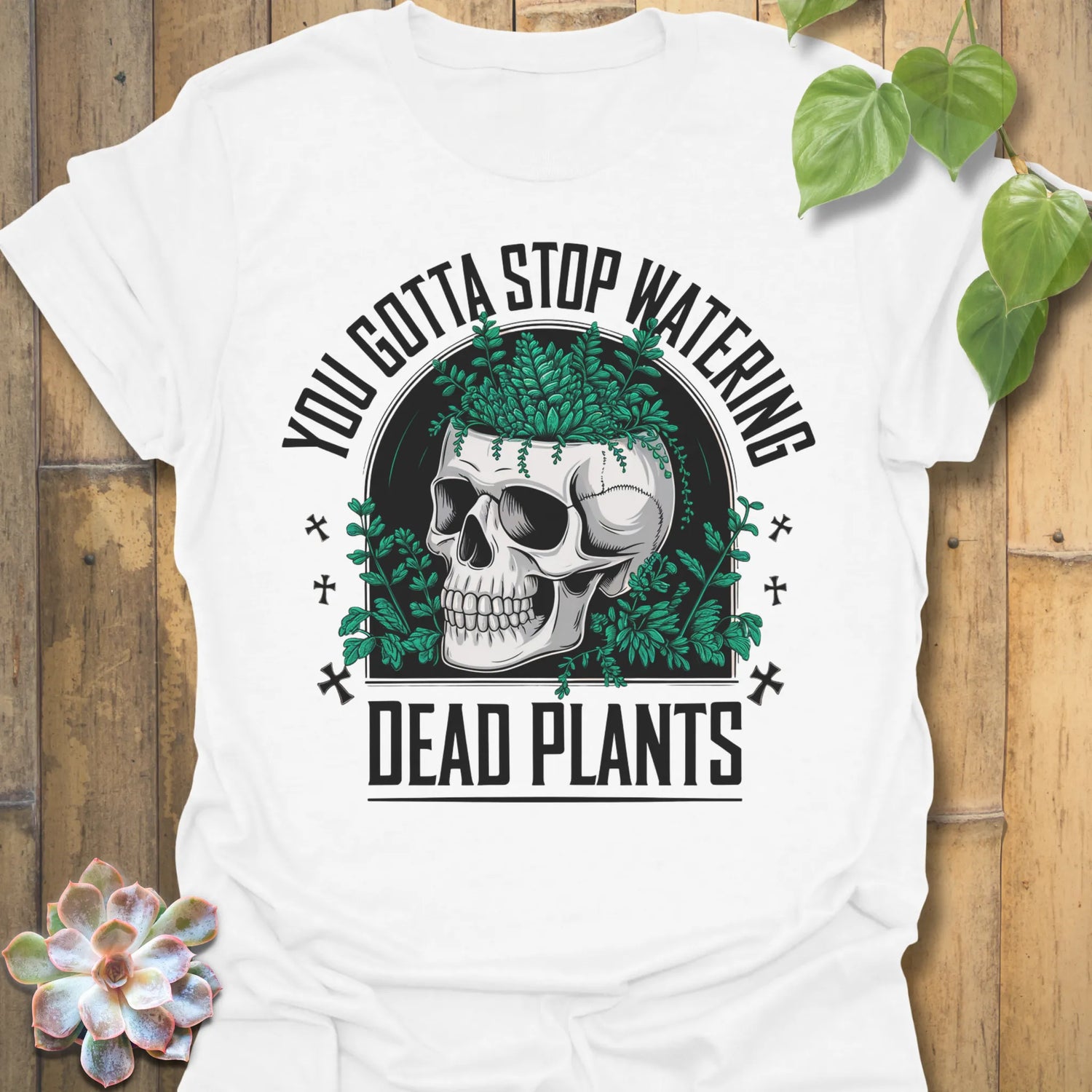 White t-shirt featuring the design Stop Watering printed in bold black letters, funny garden quote shirt
