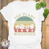 White t-shirt featuring the design The Plant Whisperer with a plant in a pot, perfect for plant lovers and gardening enthusiasts.