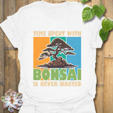 White t-shirt featuring the design “Time spent with bonsai is never wasted” with a bonsai plant print, perfect for bonsai lovers and casual wear.