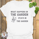 White t-shirt featuring the design What Happens in the Garden Stays in the Garden, perfect gardening graphic tee.